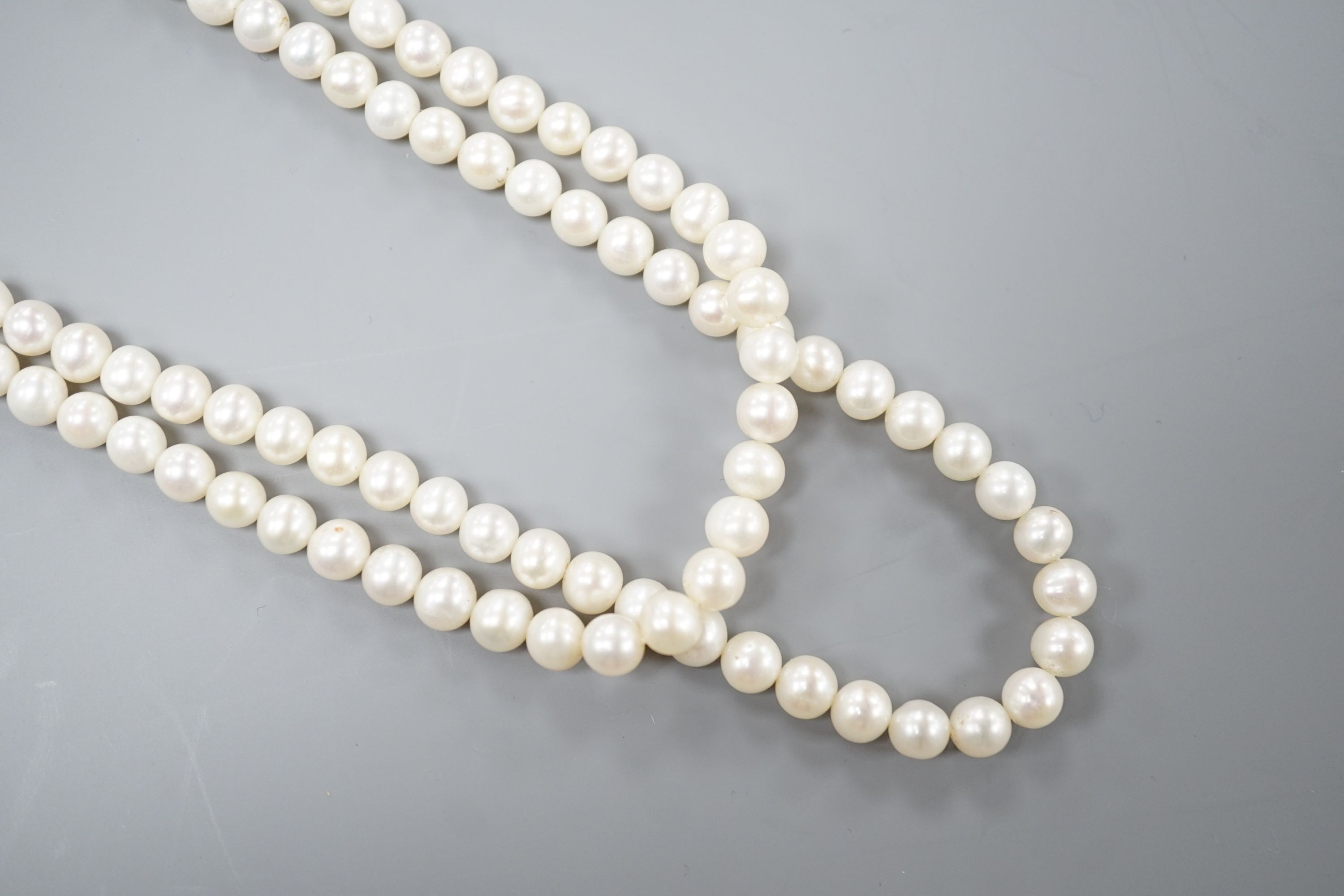 A Portuguese double strand cultured pearl necklace, with diamond set 800 finesse white metal clasp, 23.5cm.